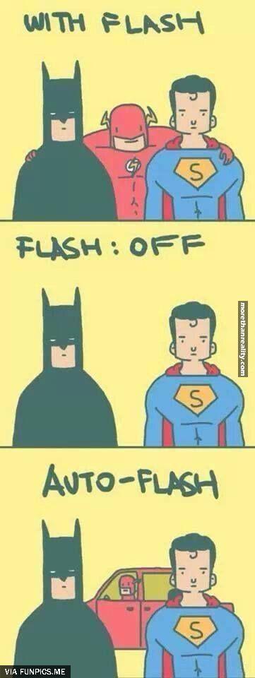 Superman and Batman taking picture with Flash